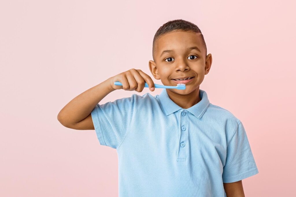 A kid brushing teeth