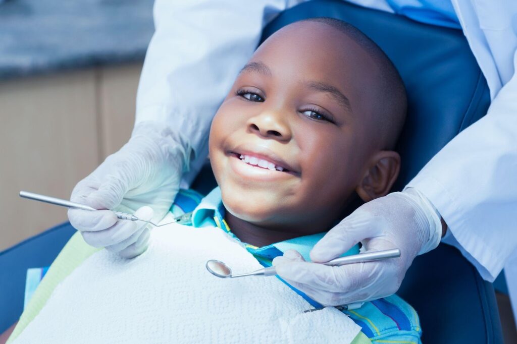 A child at dentist’s office preventing dental anxiety