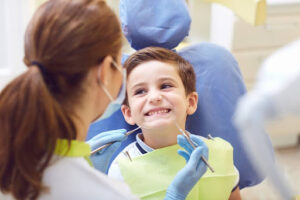 Pediatric dentistry tips for athletes - Child on a regular checkup at the pediatric dentistry.