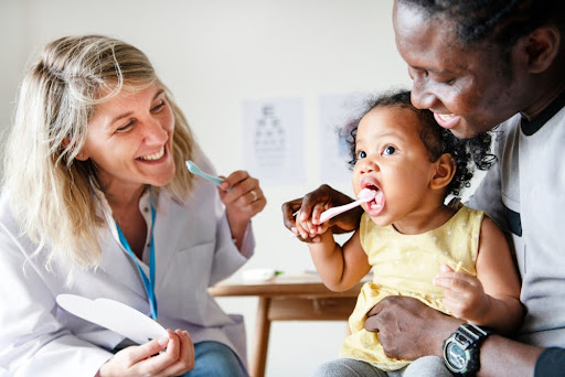 A child learning about the importance of early dental visits.